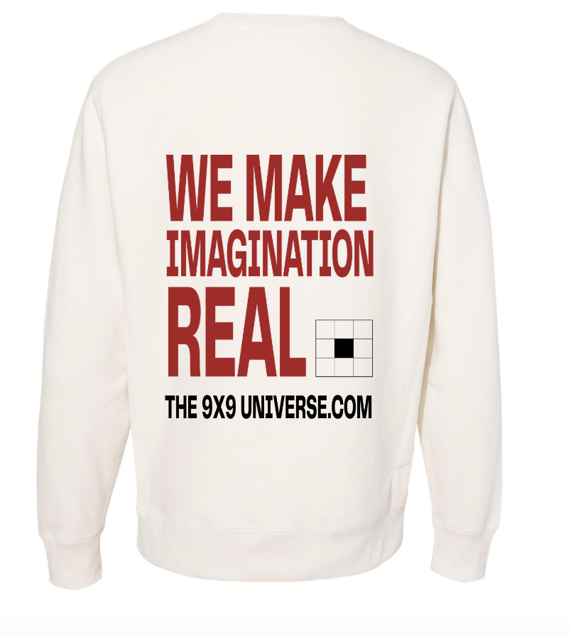 Back of the cream Founding Citizen crewneck reading We Make Imagination Real.